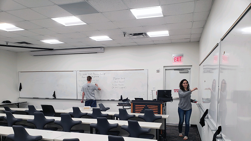  A duo searches for various scientists’ names to decipher a riddle. Photos courtesy of University of Texas at Dallas SPS chapter.