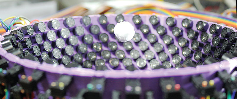 A styrofoam particle of 1.6 cm (1.88 wavelengths of sound) trapped in the center of a 40 kHz ultrasonic generator of virtual vortices.  All photos courtesy of University of Bristol.