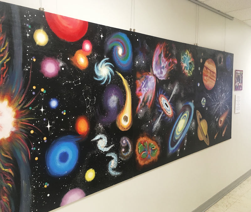 Cosmic Triptych on display in the University of Utah James Fletcher Building. Photo courtesy of Teddy Anderson.