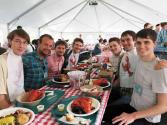 Ian (far left) and Andrew (far right) enjoy a lobster dinner at the conference.